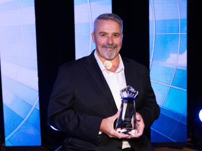 NSCN's CEO, Doug Bungay, holding Catalyst Award