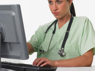 nurse at a computer