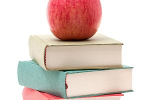 image of apple on stack of books